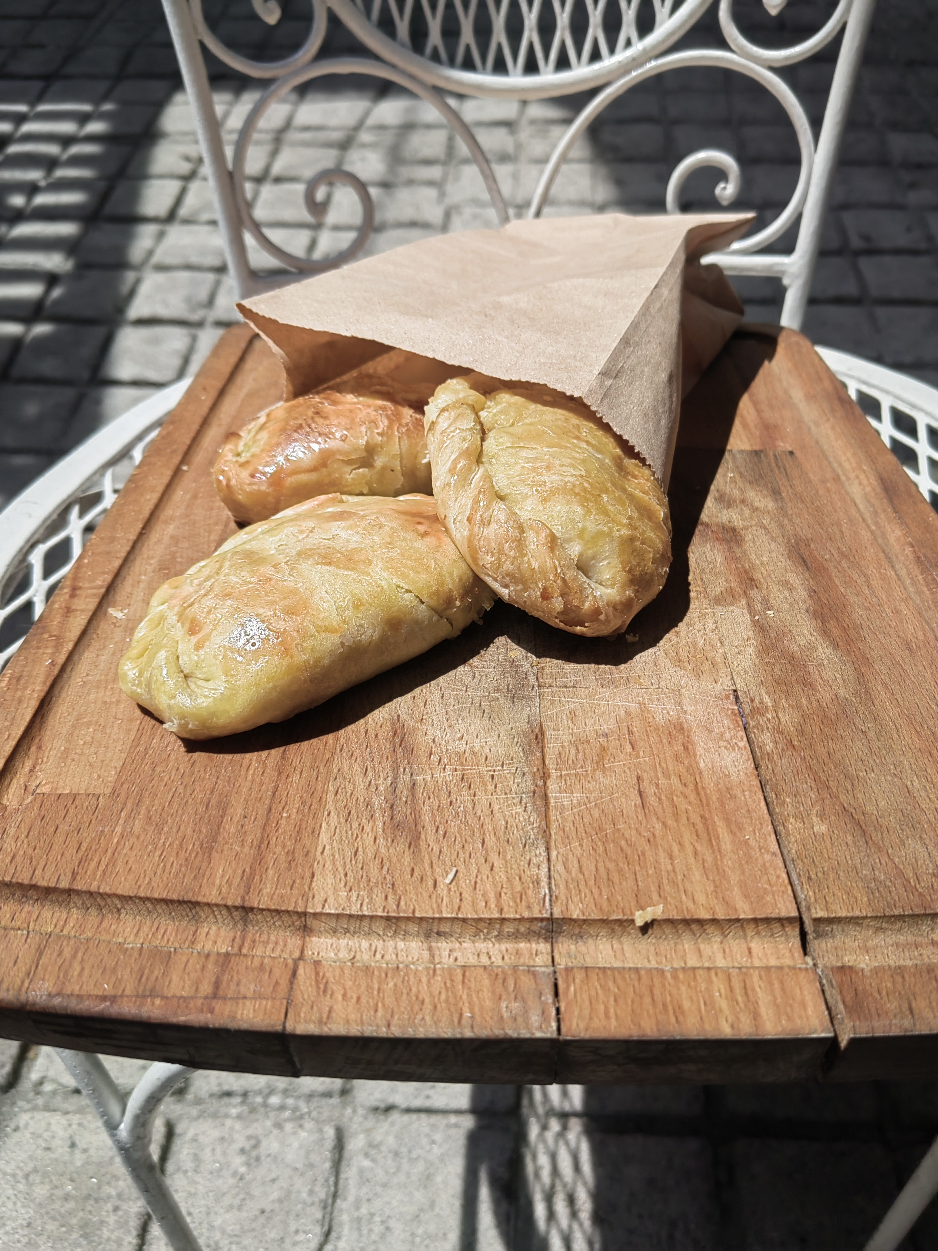 Fresh pastries being dusted with flour